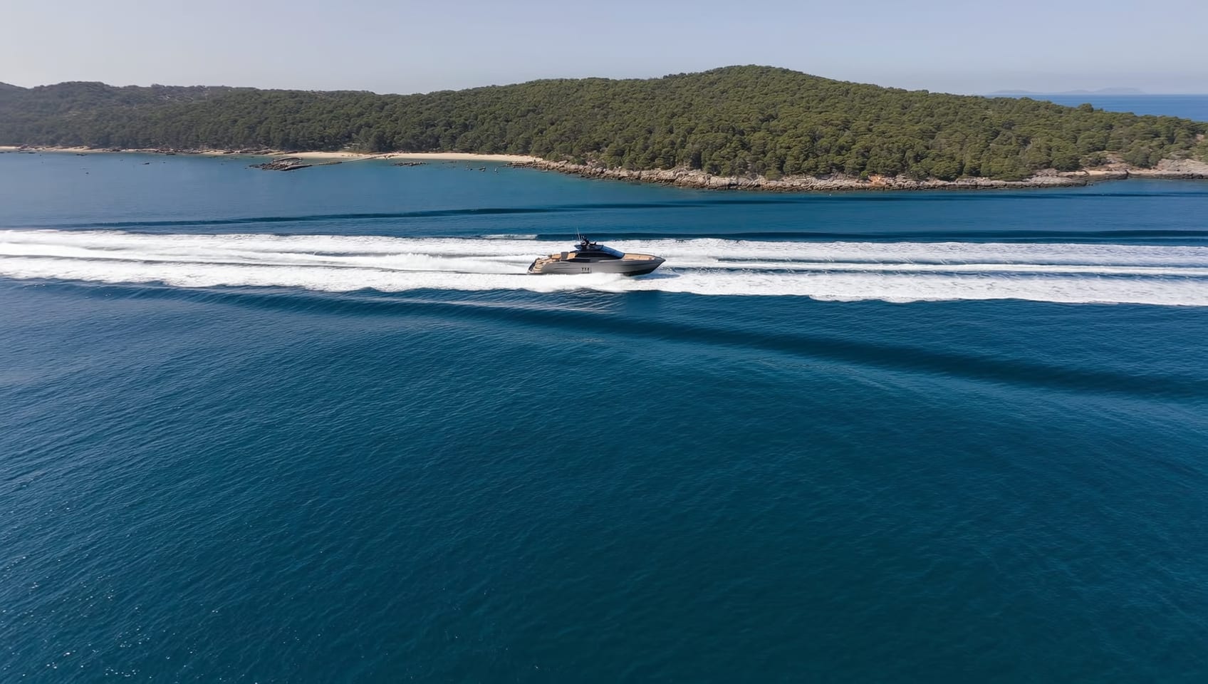 Aerial view of the Gran Turismo 40 running across dark blue water