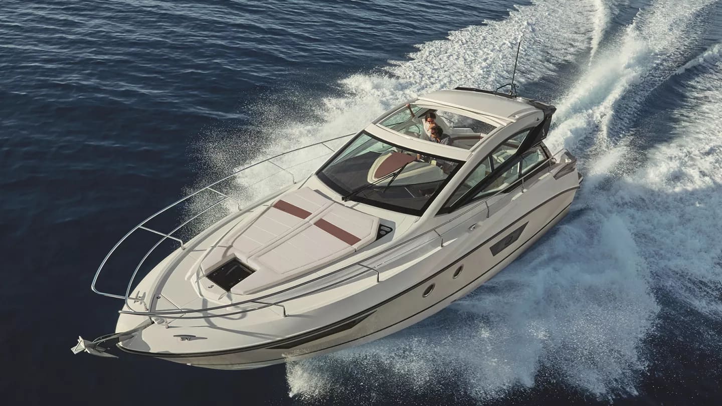 Aerial view of the Gran Turismo 40 slicing through dark blue water